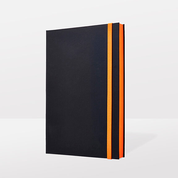Black notebook with bright orange pages and orange ribbon