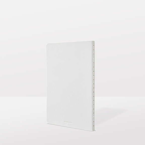 White notebook with spiral binding and subtle embossing at the bottom edge