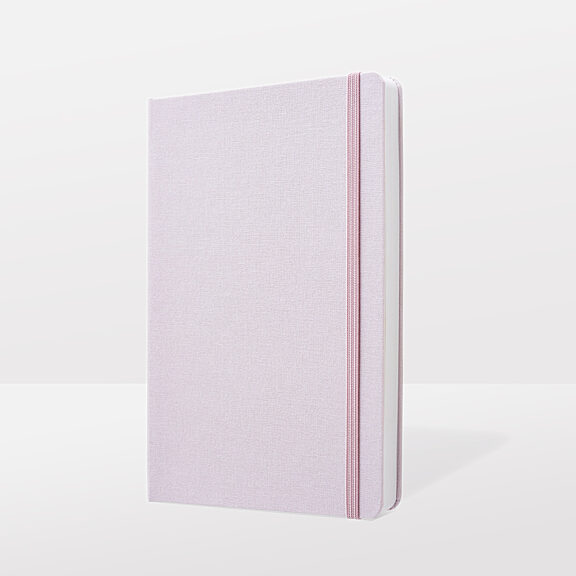 Pink notebook with delicate fabric cover and pink ribbon